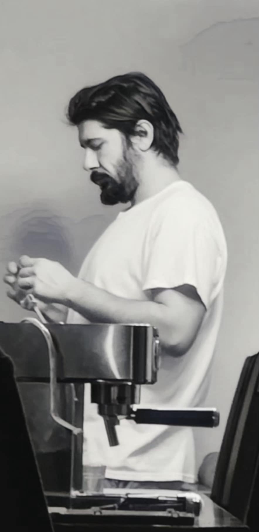 Elijah at work, in black and white, focused on the task in his hands